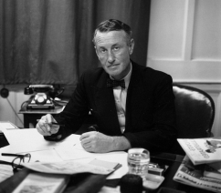 Ian Fleming at his desk