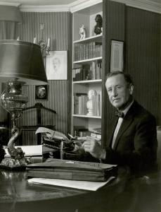 Ian Fleming at his London office