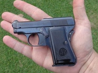 Size of the Beretta 418 compared to a man's hand